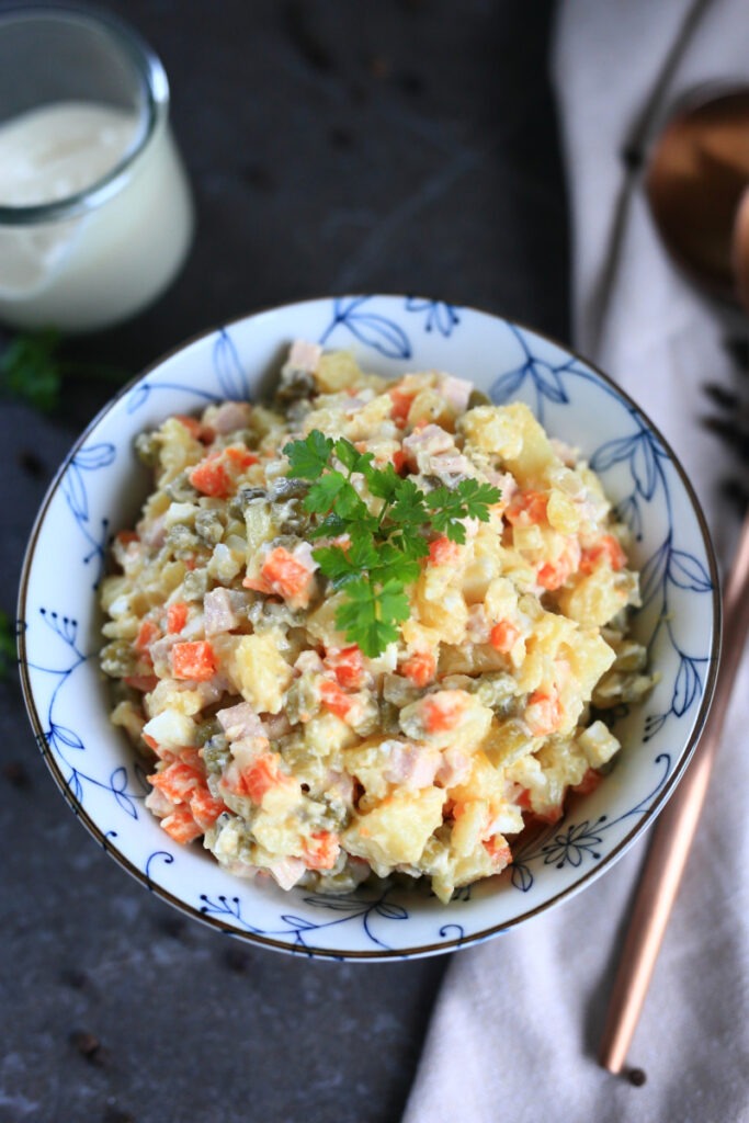 Olivye Russian Potato Salad served in a bowl.