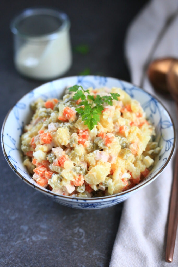 Olivye Russian Potato Salad served in a bowl.