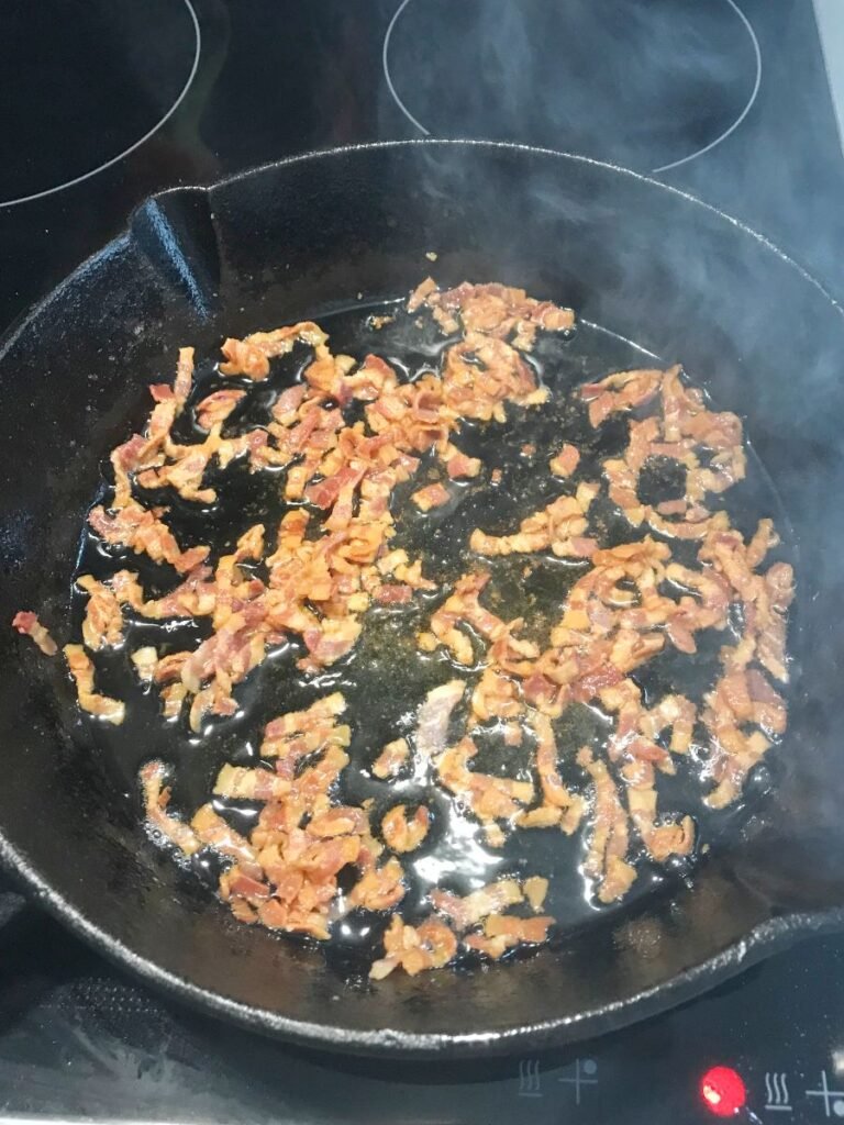 Bacon fried in a cast iron skillet