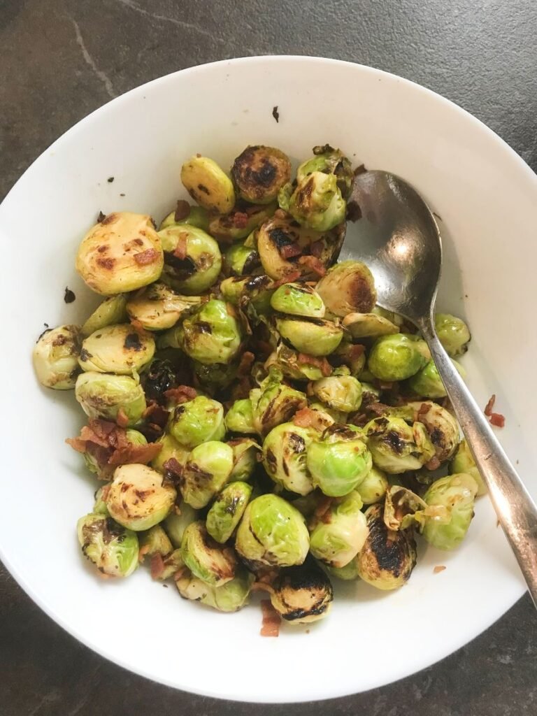 Cast Iron Brussels Sprouts with bacon in a bowl