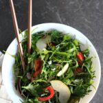 Arugula Pear Salad served in a bowl