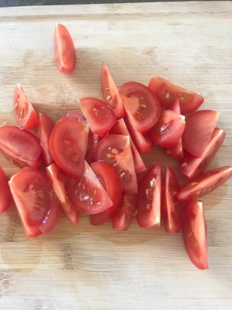 Sliced tomatoes on a cutting board