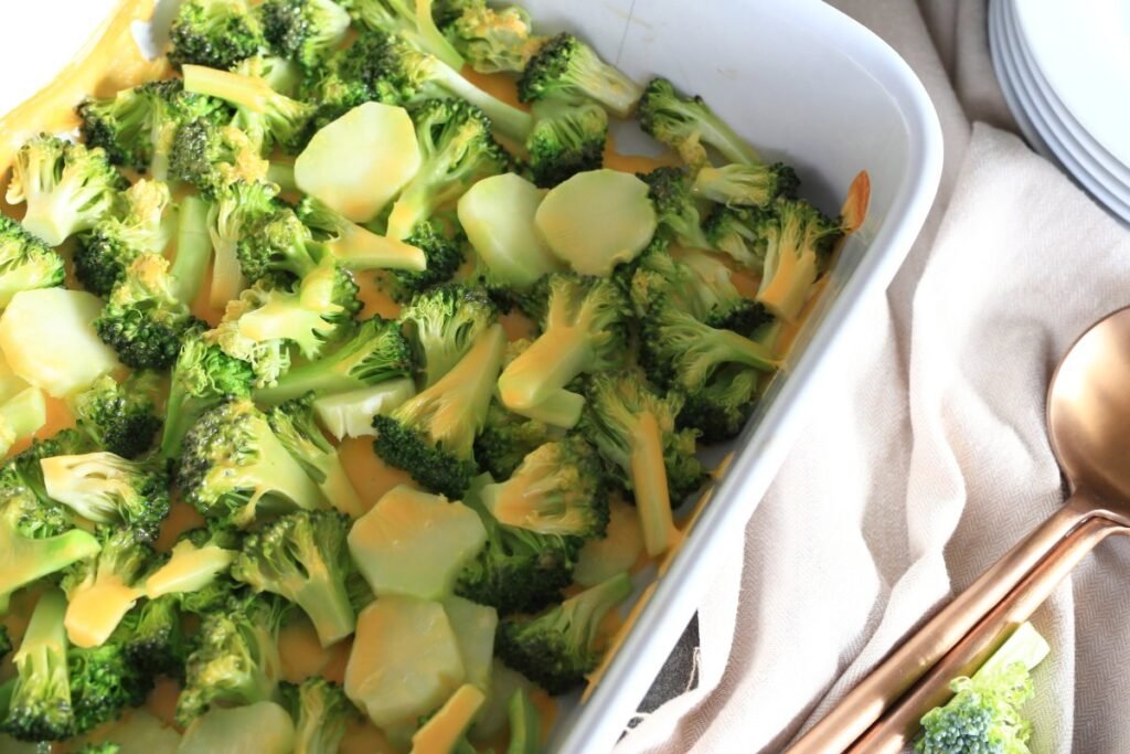 Broccoli and cheese backed in a white casserole dish