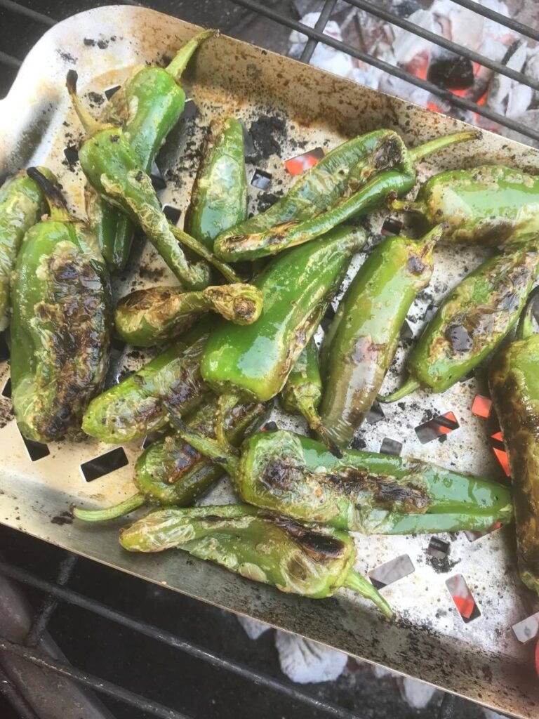 Snack peppers grilled on a grilling tray