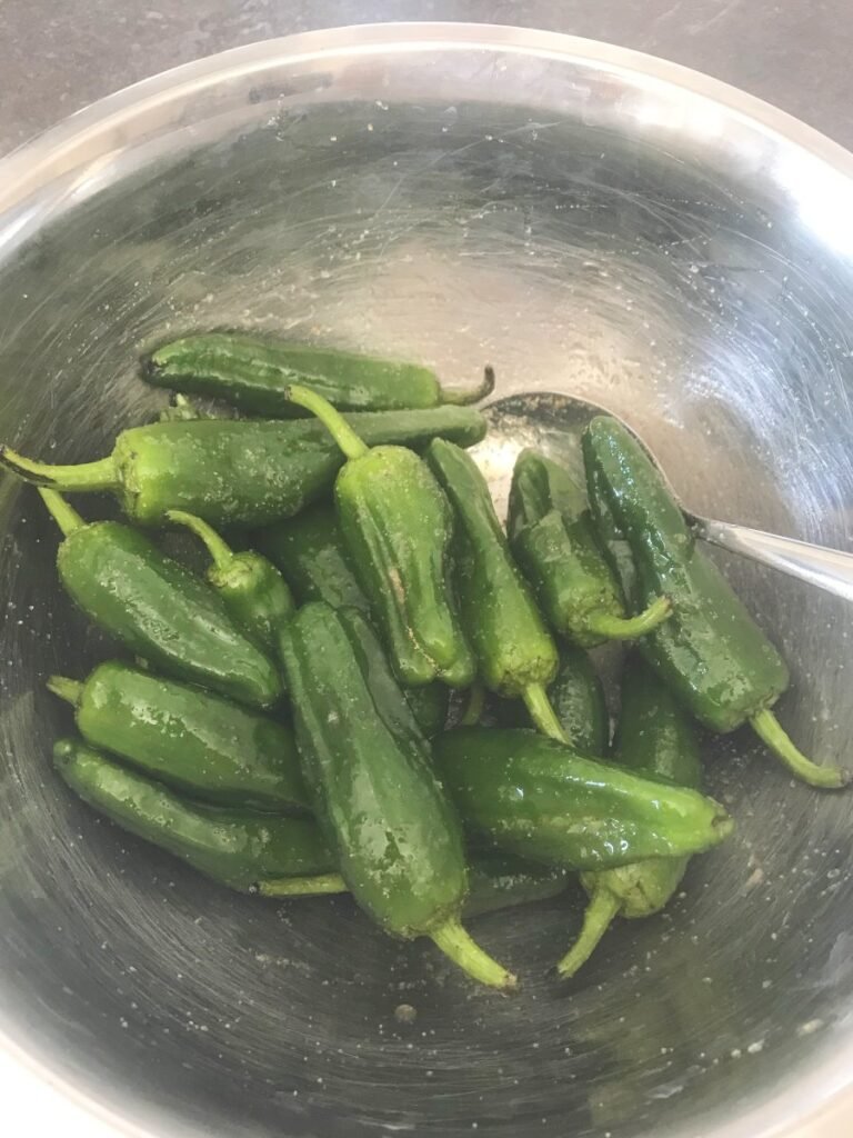Snack peppers mixed with herbs, oil, and white wine vinegar