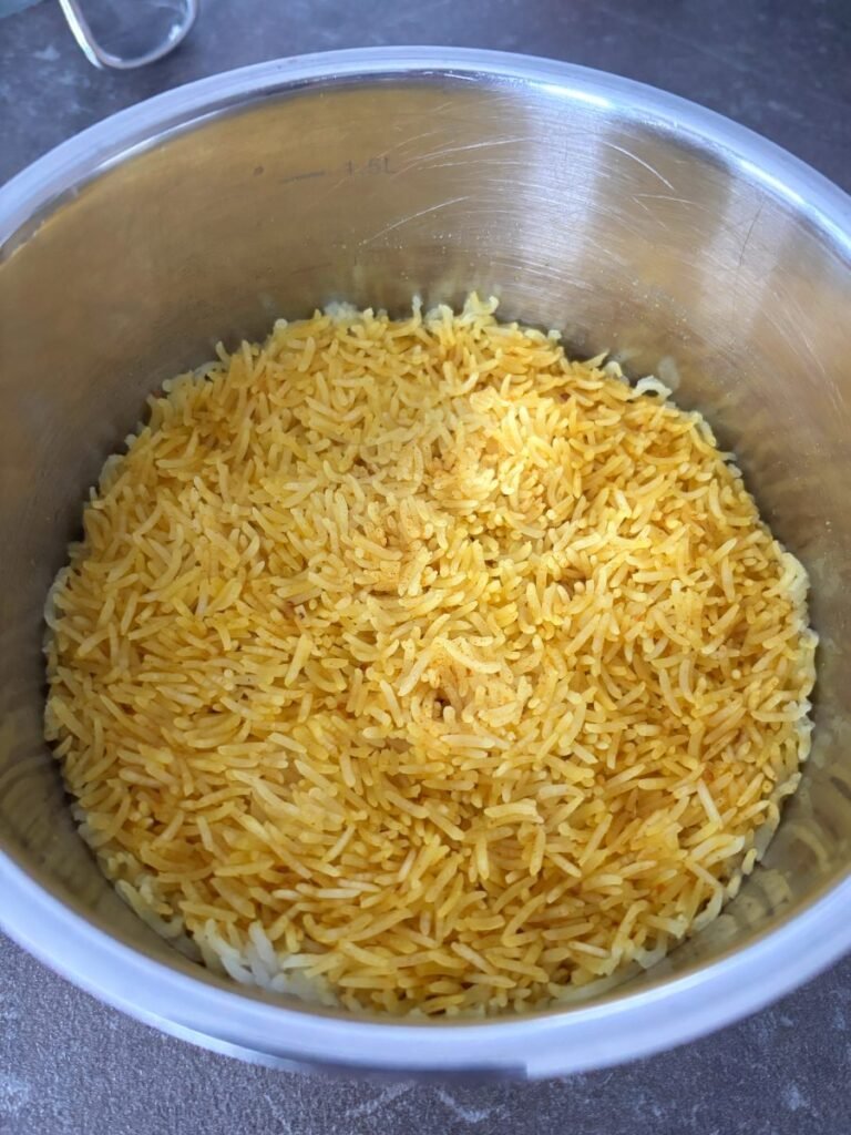 Cooked spiced rice in a saucepan