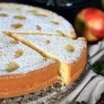 Sponge cake with apples on a platter