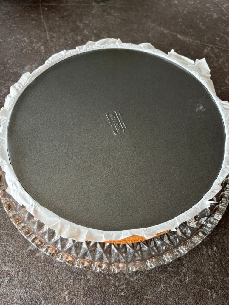 Apple sponge cake inverted on cake platter