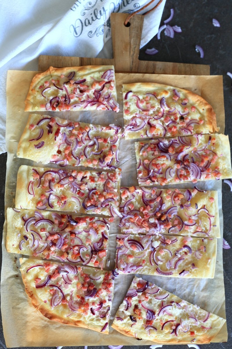 Flammkuchen served on a cutting board