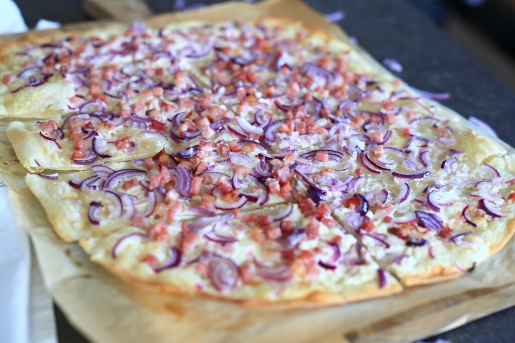Flammkuchen served on a cutting board