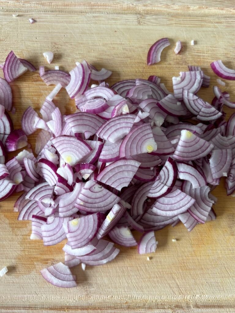 Sliced onions on a cutting board