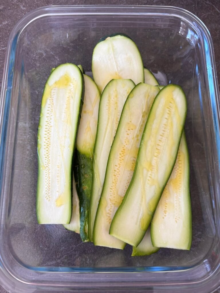 Zucchini slices sprinkled with olive oil
